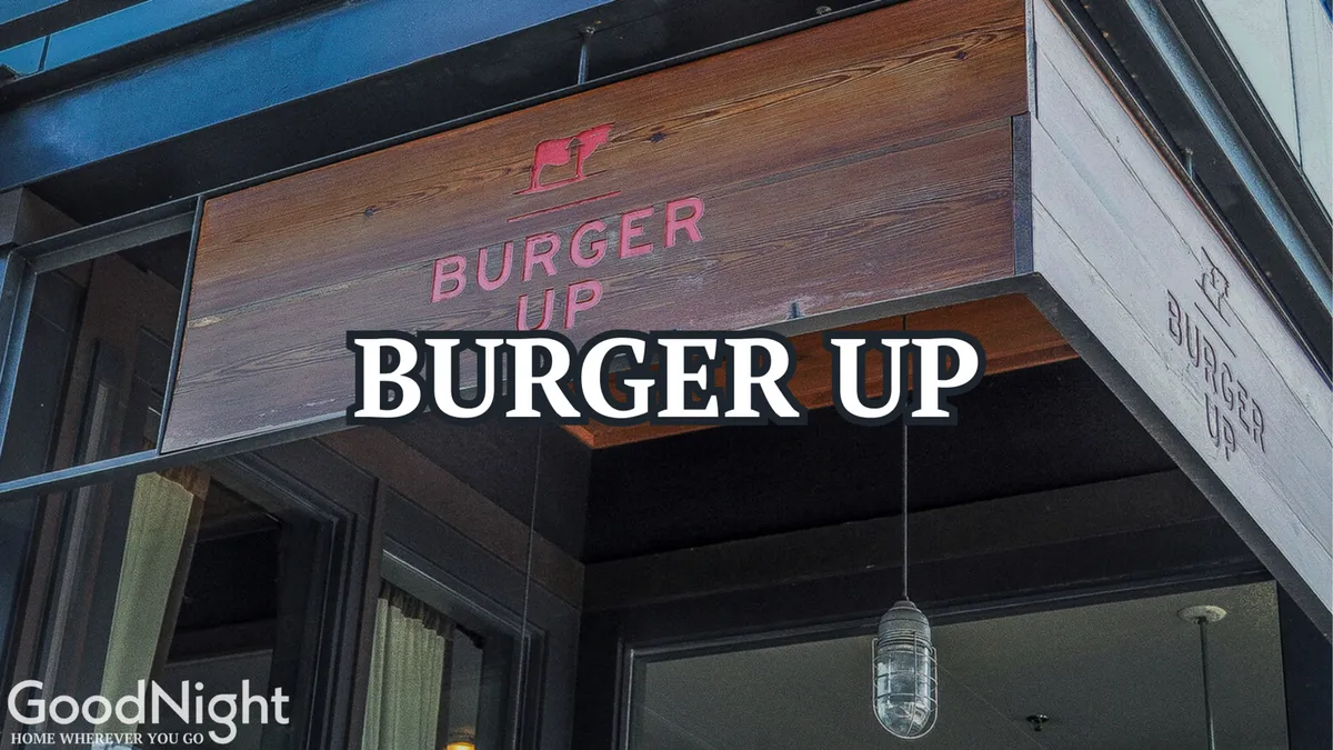 The exterior of Burger Up, featuring rustic wooden facade, inviting signage, and hanging lights. The space is designed for casual outdoor dining and socializing, capturing the spirit of local eats and friendly gatherings.
